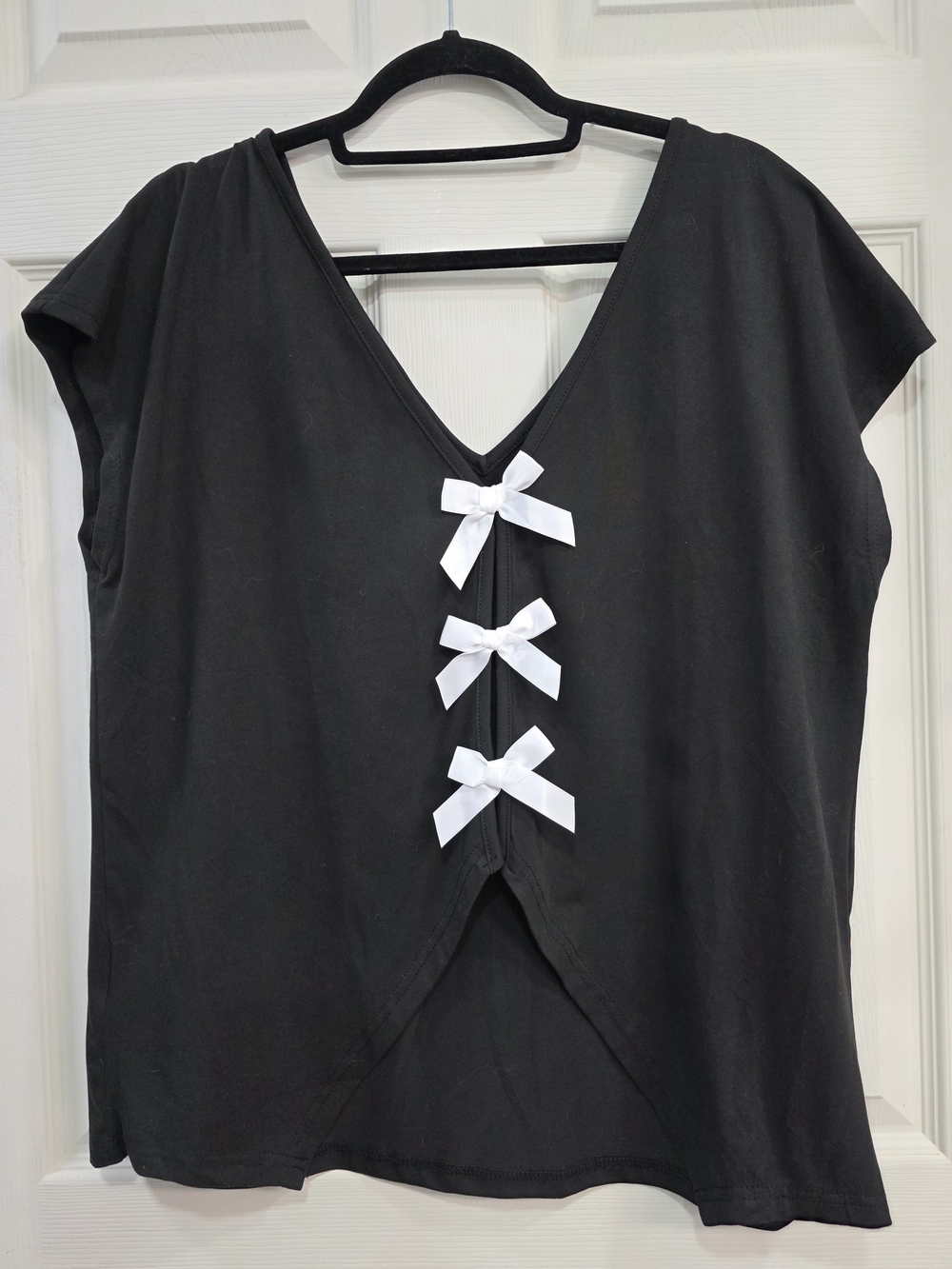 Women’s Black V-Neck Top with White Bow Accents